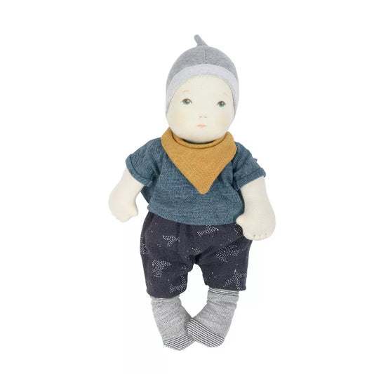 A Moulin Roty Baby Boy with a hat and scarf on.