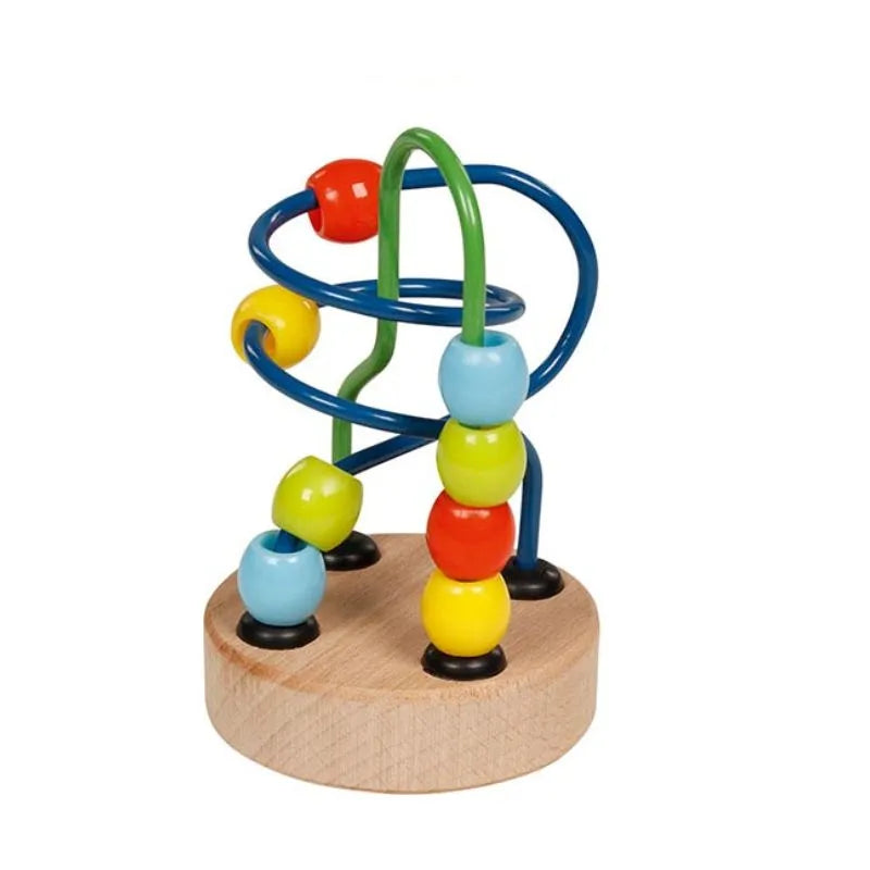 The Small Bead Maze Toy Green Blue is a classic wooden maze toy featuring vibrant beads in red, blue, yellow, and green. Strung on twisting metal wires secured to a round wooden base, it's an ideal stocking filler for children to develop fine motor skills while enjoying countless hours of fidgety fun.