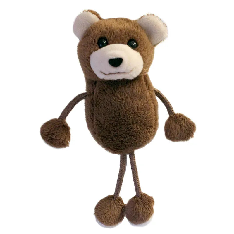 The Puppet Company Bear Finger Puppet features a soft brown body with a white snout, black eyes, and a gentle smile. Its rope-like arms and legs, paired with fluffy hands and feet, make it perfect for cuddly storytime adventures. Set against a plain white backdrop, it exudes finger puppet charm.