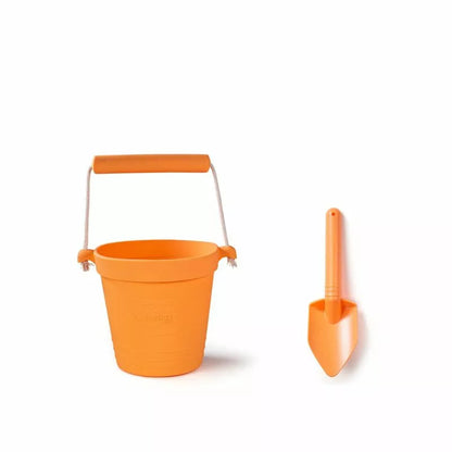A Bigjigs Apricot Eco Bucket & Spade on a white background.