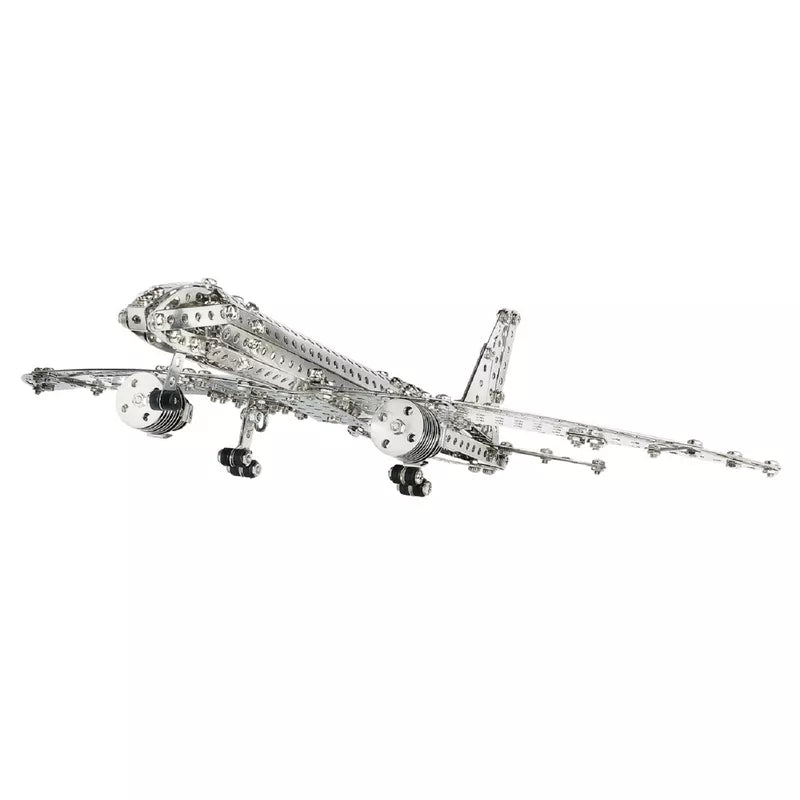 A Eitech Construction Aircraft, made from a metal Model Building kit, gracefully soaring through the air.
