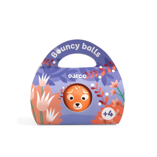 A colorful package labeled "Djeco Skill Game Bouncing Ball - Wild Deer" with a cheerful lion face in the center, surrounded by floral illustrations, and a handle on top for easy carrying. Intended for children ages 4 and older.