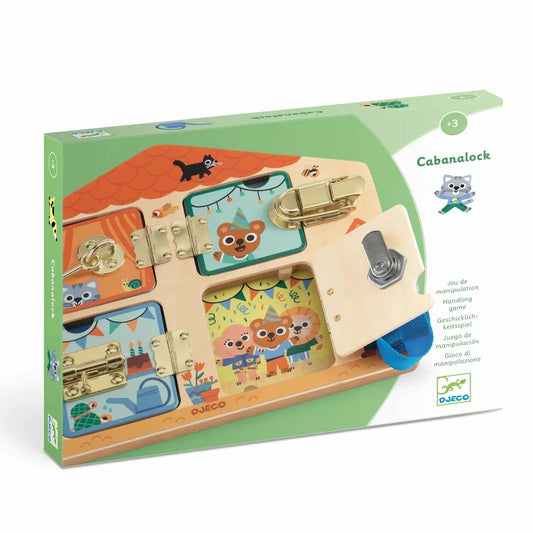 The image shows a children's educational toy called "Djeco Educational Wooden Game Cabanalock" in its retail packaging. This Djeco toy features a wooden board with various locks and latches for kids to manipulate, enhancing their early learning stages. The primarily green packaging is adorned with illustrations of animals and houses.