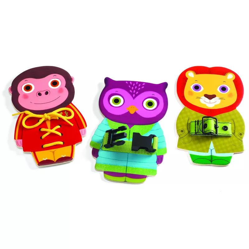 Three different animal shaped magnets sitting next to each other.