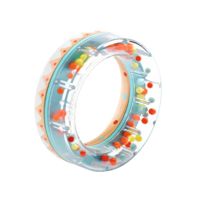 The Djeco Early Years BabyRing is a transparent circular rattle that’s easy to hold, filled with colorful beads and features a white and orange zigzag pattern, reminiscent of a wooden rain ring.