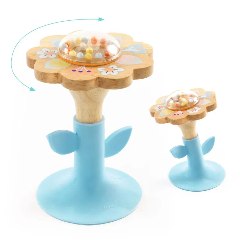 Two Djeco Early Years BabySwipi wooden toys feature blue bases with rotating tops filled with colorful beads. Each has leaf-like accents and a secure suction cup. The set includes a larger toy, both resembling playful, flower-shaped rattles.