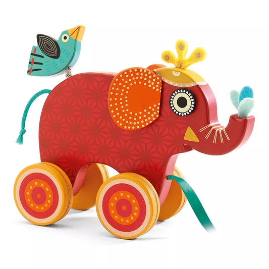 A Djeco Indy Pull along Toy elephant with a bird on its back.