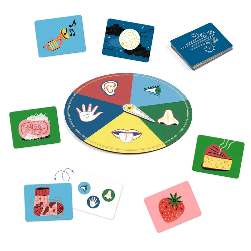A colorful array of Djeco Educational Games Sensico - FSC MIX components, including a round spinner divided into eight sections with simple icons and multiple square cards with illustrations like animals and objects.