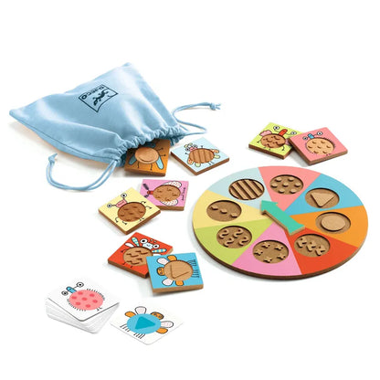 A colorful children's sensory recognition game called Djeco Educational Games Tactil-Bzzz with various wooden animal-shaped pieces and a blue drawstring bag, displayed on a white background.