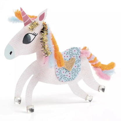 A Djeco Paper Creations Creativity kit with a white toy horse, pink mane and gold horn.