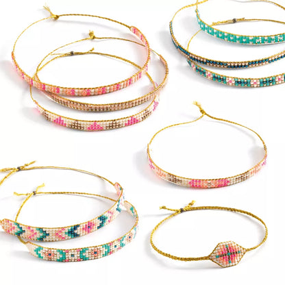 A set of five Djeco Jewels to Create Tiny Beads bracelets with different colored beads.