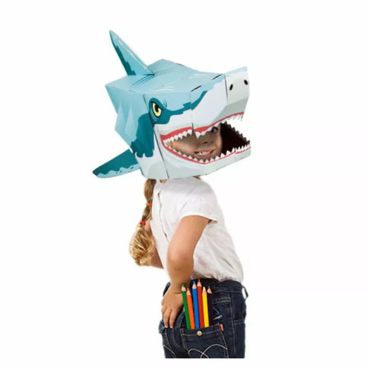 A child wearing a Shark 3D Mask with a pencil in his mouth.