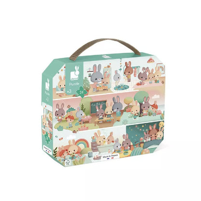 A Janod Puzzle A Day 24 pcs box with a bunch of animals inside of it.