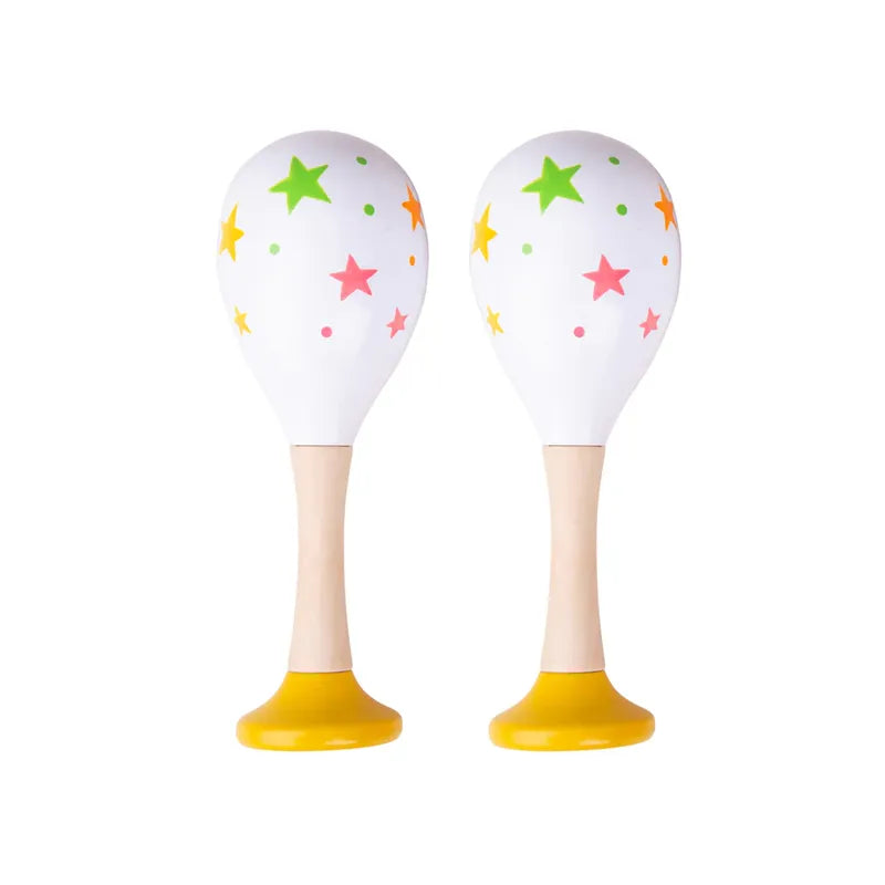 The Bigjigs Junior Maracas Yellow are charming wooden musical toys for toddlers, featuring colorful star patterns in pink, green, and orange on a white surface. The handles are crafted from wood, with bright yellow bases set against a plain white background.