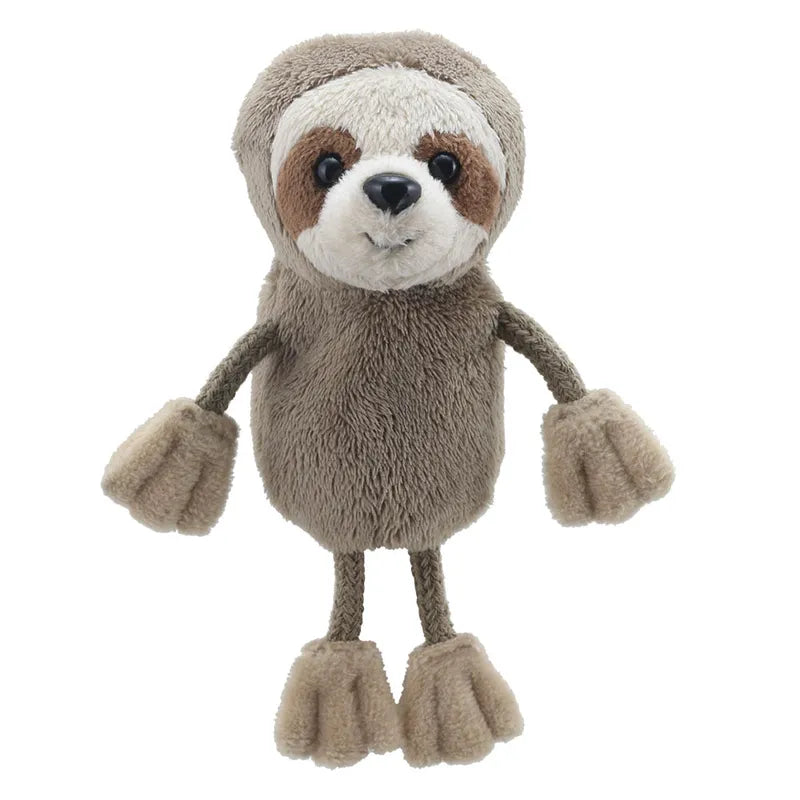 The Puppet Company Sloth Finger Puppet is an interactive plush toy, light brown with a beige face, round face, dark eyes, and distinctive eye rings. It stands upright with arms and legs outstretched, ideal for children aged 12 months+ to explore.