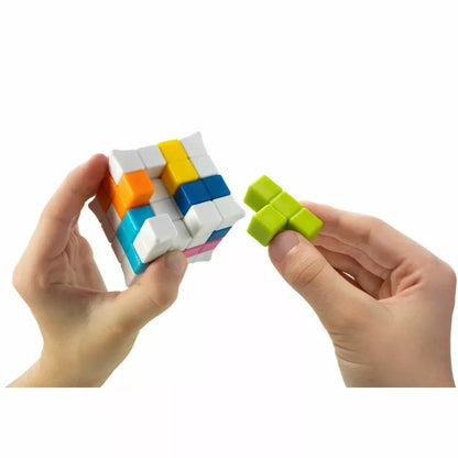 A pair of hands skillfully manipulating a colorful SmartGames Plug & Play Puzzler, tackling the challenges of this intricate puzzle game.