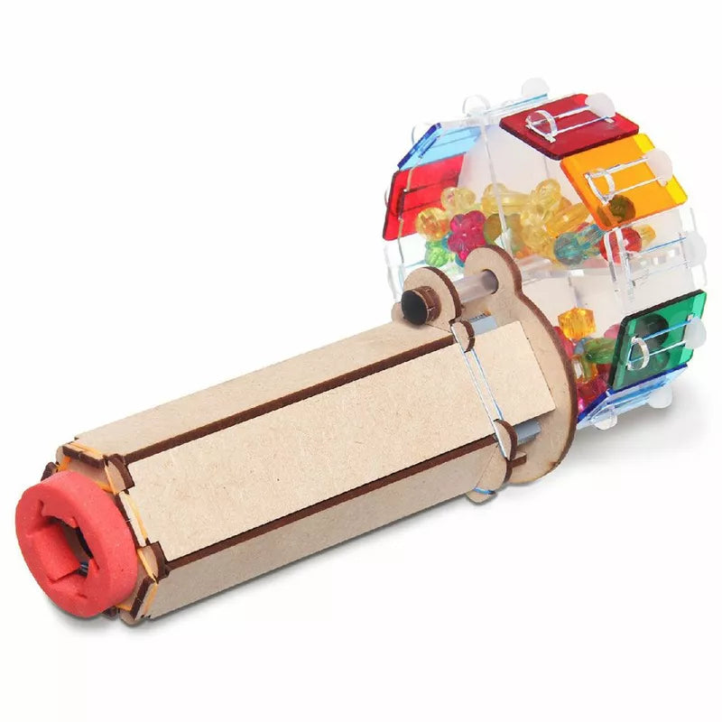 A construct with a plastic tube and Smartivity Kaleidoscope patterns inside of it.