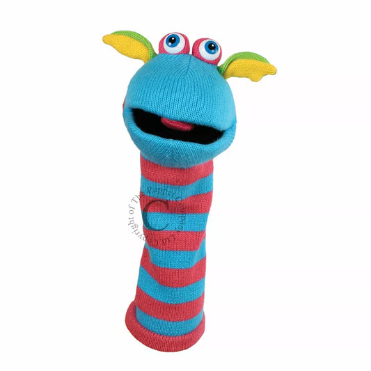 A colourful Sock Puppet named Sockette Puppet Scorch It’s knitted body is pink and blue. It has big expressive eyes and is mouth moving.