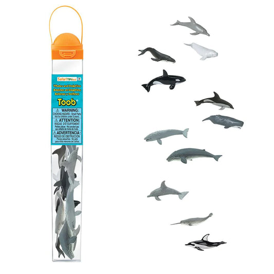 a group of TOOBS® Figurines Whales & Dolphins on a stick next to a bottle.