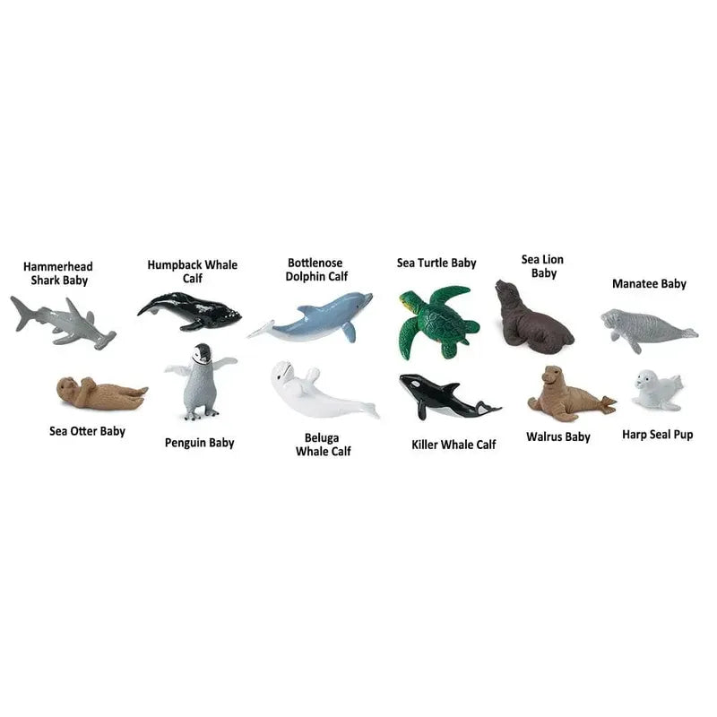 A collection of TOOB® Figurines Baby Sea Life representing various marine animals, including a hammerhead shark, humpback whale calf, bottlenose dolphin, sea turtle baby, sea otter baby, penguin