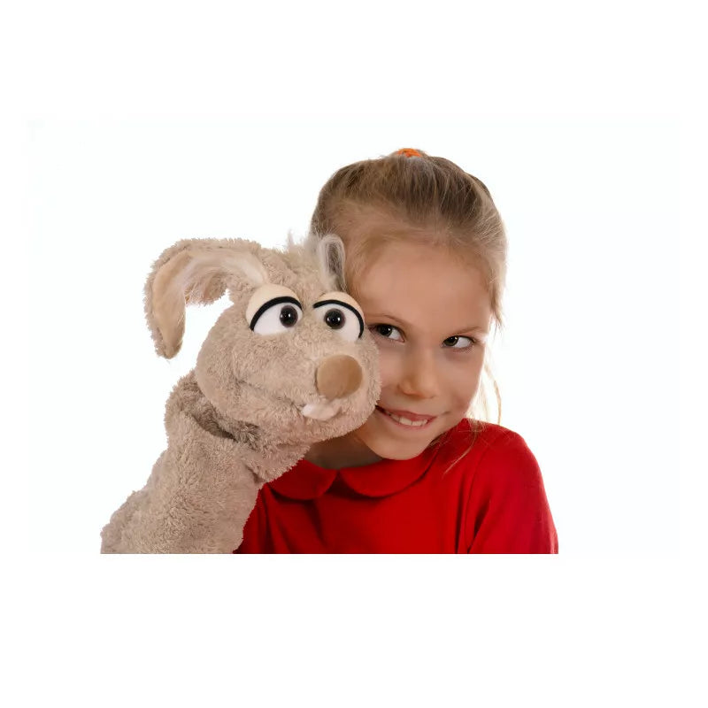 A little girl holding a Living Puppets Manfred the Mouse Glove Puppet.