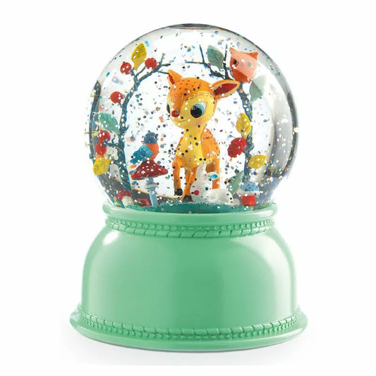 A Djeco Snow Ball Nightlight Fawn with a deer inside of it.