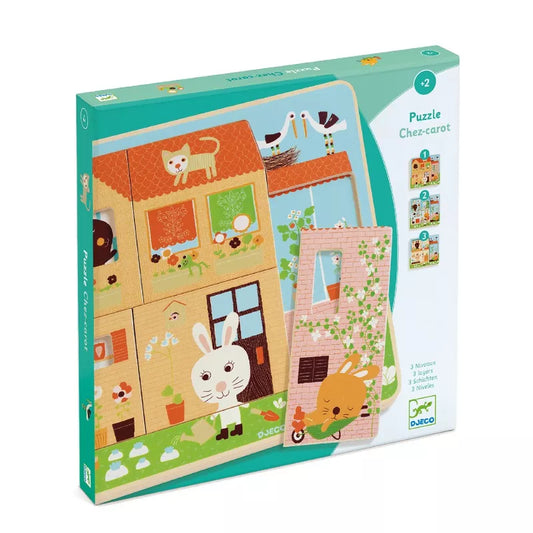 A Djeco puzzle box with a picture of a house and a cat.