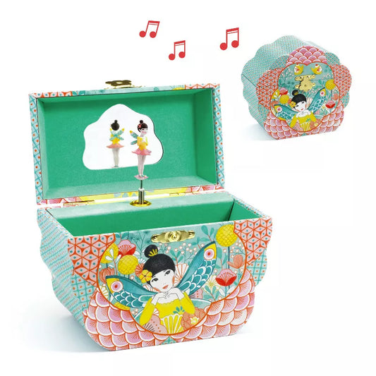 An open Djeco Musical Box Flowery Melody with a picture of a girl on it.