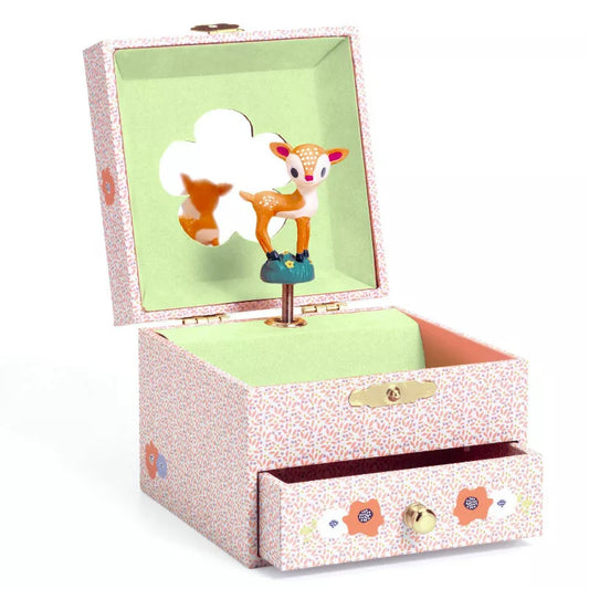 A Djeco Musical Box Wood fawn with a picture of a fox inside of it.