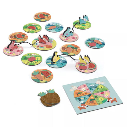A Djeco PicNic Game set of magnets that are on a table.