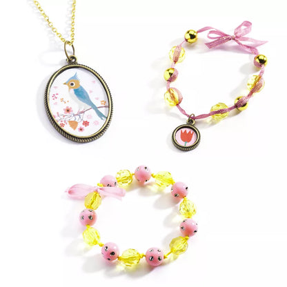 Three Djeco Beads and Flowers bracelets and a Djeco Beads and Flowers pendant on a white background.
