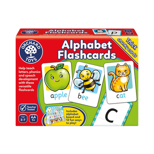 A vibrant package of Orchard Toys Alphabet Flashcards is displayed, showcasing illustrated cards with an apple labeled "apple," a bee labeled "bee," and a cat labeled "cat." The packaging highlights that it contains educational games suitable for children aged 3-7.