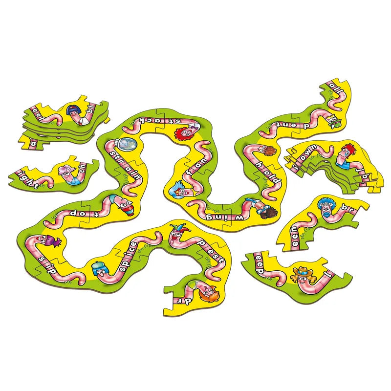 The Orchard Toys Wiggly Words is a vibrant, twisting puzzle that helps teach suffixes. It showcases cartoon characters and words such as "bravely," "splices," and "dripping," with the pieces loosely spread across a flat surface.