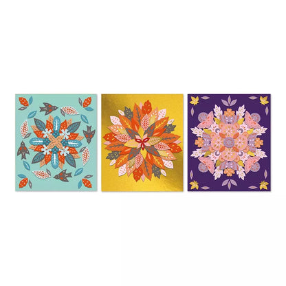 Three square panels from the Janod 3 Nature Mandalas with intricate floral patterns in symmetrical mandalas arrangement, each set against a different colored background – teal, golden yellow, and deep purple.