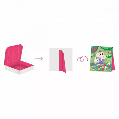 An image sequence showing three steps: an open, empty pink and white Janod 3 Years - Pompoms box on the left, a partially opened red tab in the middle, and a completed colorful garden-themed paper craft with flowers and a person on the right. Arrows indicate the progression of this delightful kids' arts and crafts activity.