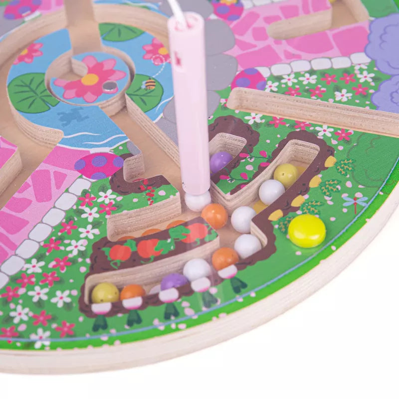A Bigjigs Flower Garden Maze Puzzle featuring a wooden flower and candy, perfect for developing fine motor skills.