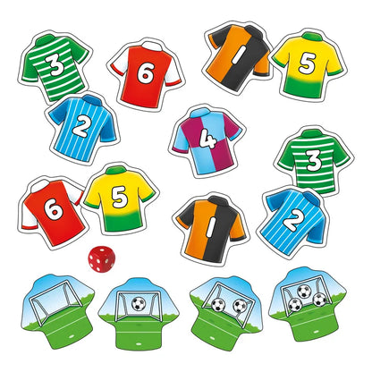 Illustration of vibrant soccer jerseys numbered 1-6 in various hues: green, red, orange, yellow, blue, and multicolored. Features goalposts and field imagery along with a red six-sided die. Product: Orchard Toys Penalty Shoot Out Mini Game.