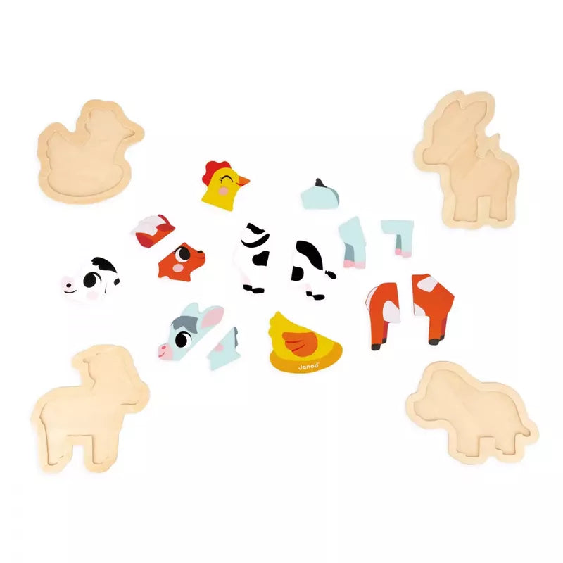 A set of Janod 4 Progressive Puzzles - Farm spread out on a light background, with some pieces fitted together to partially form a chicken, cow, duck, and sheep.