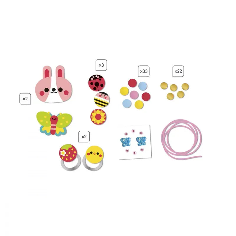 A delightful collection of Janod's 4 Pieces of Wooden Jewelry - Flower Garden includes colorful children's craft supplies such as two bunny face stickers, a butterfly sticker, eight circular stickers with various designs, 55 small circular dots in different colors, a pink string for the children's jewelry kit, two rings with animal faces, and four butterfly stickers.