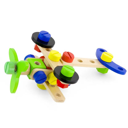 The New Classic Toys Construction Block Set 48 pieces includes a vibrant wooden toy airplane that can be assembled using various components such as green propellers, blue and yellow bolts, and natural wood body segments. Featuring primary colors, this airplane is designed to stimulate children's play and enhance their problem-solving skills.