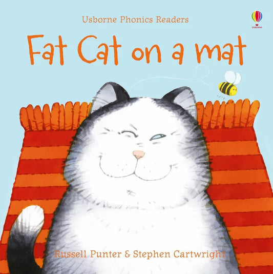 A Usborne Phonics Readers: Fat cat on a mat lounging on a cozy mat, perfect for a children's book.