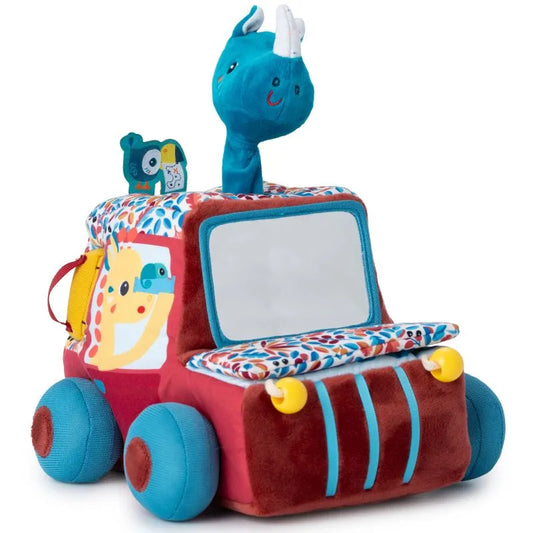 The Lilliputiens I'm Discovering Activities Car Safari is a plush toy car with a colorful design featuring a smiling blue dinosaur head, vibrant red, yellow, and blue colors, soft round wheels, and leaf patterns—ideal as a baby's first toy or gift.