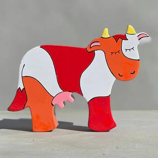 A Magnetic Wooden Cow Play Figure.