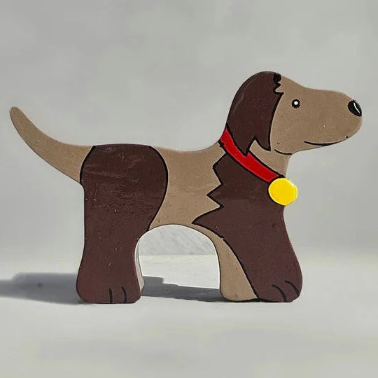 A Magnetic Wooden Dog Play Figure with a red collar.