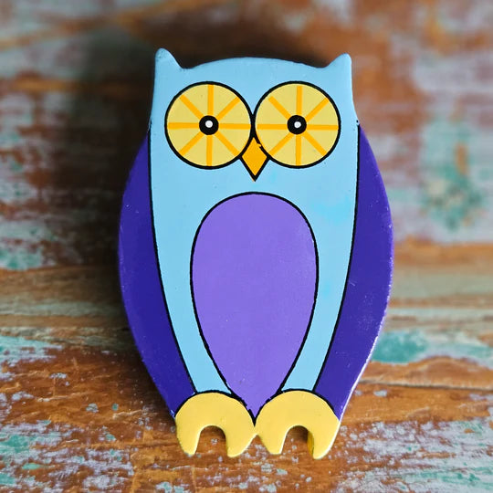 A Magnetic Wooden Owl Play Figure on a wooden surface.