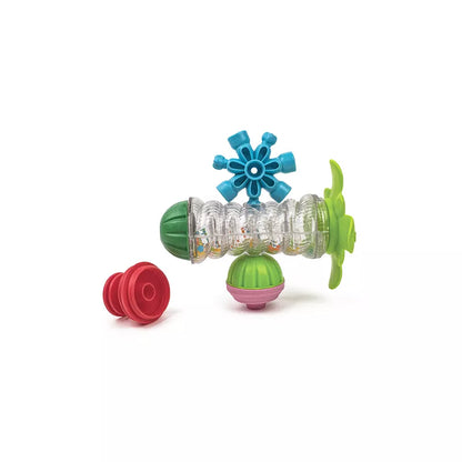 a green toy with a blue flower on top of it.