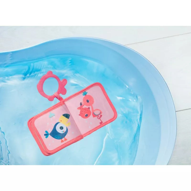 A Lilliputiens Anais Bath Playbook filled with water and a pink tag.