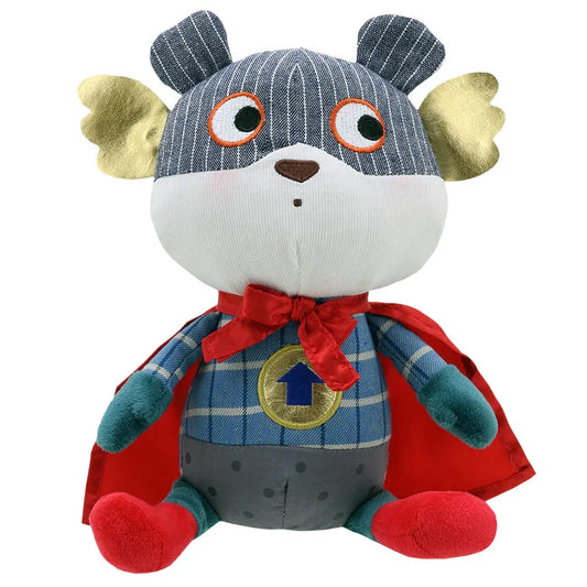 Introducing the Wilberry Super Hero Bear! This plush toy, perfect for imaginative play, sits facing forward in a superhero outfit complete with a striped mask, golden ear flaps, red cape, and bow tie. The blue plaid top features a yellow belt and blue arrow emblem on its chest. Ideal as a birthday present!