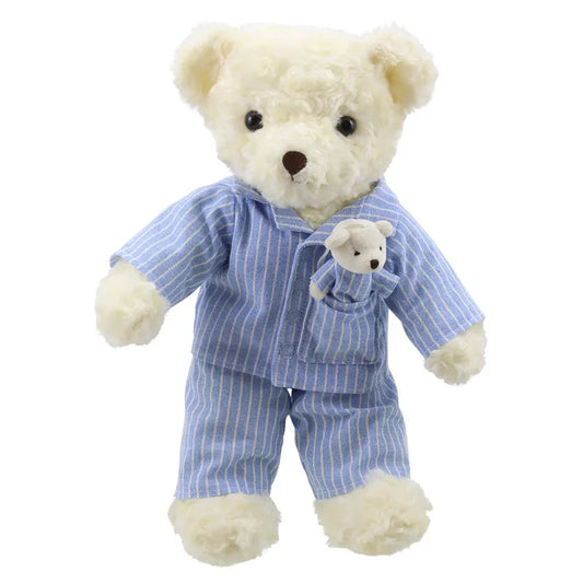 A **Wilberry Dressed Animal Bedtime Bear Pyjamas** wearing a blue and white striped pajama set, with a baby bear peeking out from the chest pocket. The larger soft bear has cream-colored fur and black eyes. Both bears appear incredibly soft and cuddly, making this duo an ideal birthday present.
