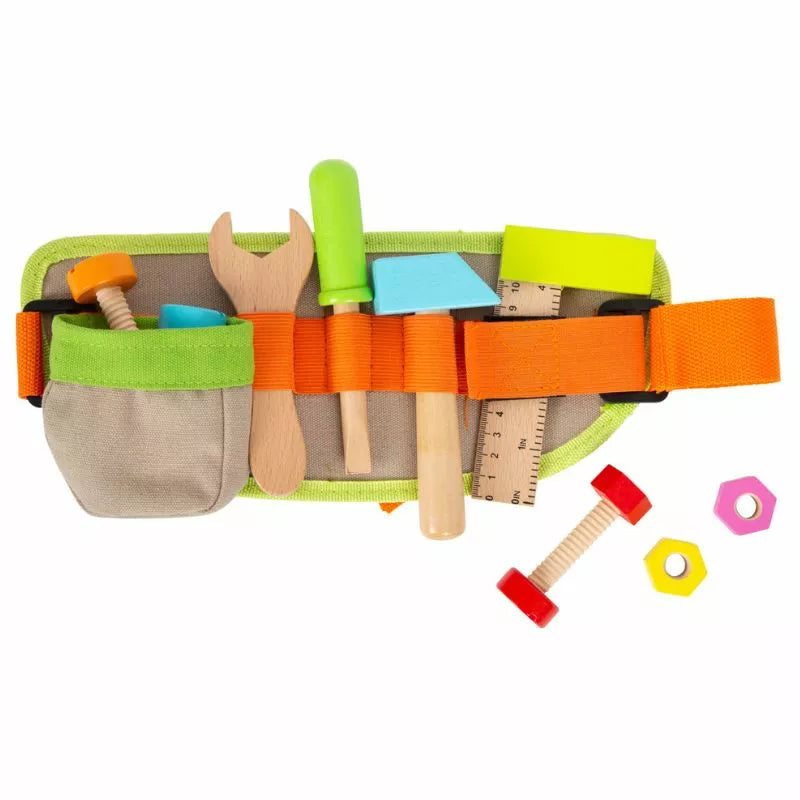 a bag filled with lots of toys on top of a white surface.